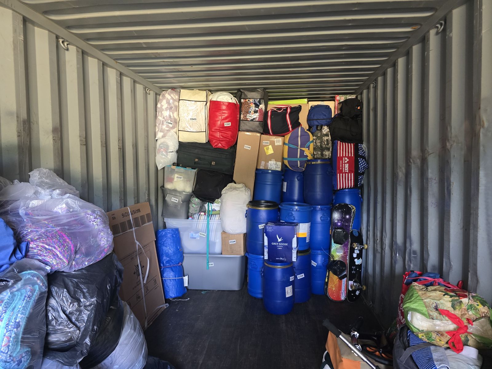 Full container delivered to a customer's home on a flatbed truck